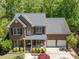 Beautiful two-story brick home with a manicured lawn and two-car garage, perfect for a Gathering at 8212 Duck Creek Dr, Raleigh, NC 27616