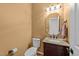 Cozy half bathroom with a toilet and vanity at 8212 Duck Creek Dr, Raleigh, NC 27616
