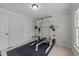 Workout area with weight training equipment and natural light at 8212 Duck Creek Dr, Raleigh, NC 27616