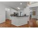 An open kitchen with a breakfast bar, stainless appliances, and dark countertops at 8212 Duck Creek Dr, Raleigh, NC 27616