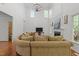Spacious living room with tall ceilings, fireplace, and lots of natural light at 8212 Duck Creek Dr, Raleigh, NC 27616