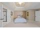 Bright main bedroom boasting trey ceilings, ensuite bathroom, and neutral colored walls at 8212 Duck Creek Dr, Raleigh, NC 27616
