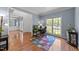 Well-lit home office with hardwood floors, large window, and view of backyard at 8212 Duck Creek Dr, Raleigh, NC 27616
