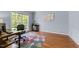 Cozy office with hardwood floors and a stylish desk at 8212 Duck Creek Dr, Raleigh, NC 27616