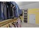 Spacious walk-in closet with custom shelving, abundant storage, and organized hanging space at 8212 Duck Creek Dr, Raleigh, NC 27616