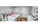 Spacious craft room featuring a large work table, ample storage, and bright lighting at 8764 Kenridge Ln, Fuquay Varina, NC 27526