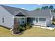 Charming single-story home with gray siding, manicured landscaping, and a well-maintained lawn at 8764 Kenridge Ln, Fuquay Varina, NC 27526