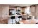 Bright kitchen featuring white cabinets, stainless steel appliances, and a center island with barstool seating at 8764 Kenridge Ln, Fuquay Varina, NC 27526