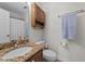 Bathroom featuring a granite vanity top, white cabinets, and a toilet at 903 Oldwyck Dr, Fuquay Varina, NC 27526