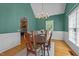Charming dining room with wood floors, elegant chandelier, and view into kitchen at 903 Oldwyck Dr, Fuquay Varina, NC 27526