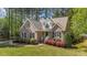 Beautiful brick home with lush landscaping, inviting curb appeal, and classic architectural details at 903 Oldwyck Dr, Fuquay Varina, NC 27526