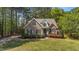 Charming brick home featuring manicured landscaping and mature trees in a desirable neighborhood at 903 Oldwyck Dr, Fuquay Varina, NC 27526