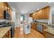 Spacious kitchen with an island, stainless steel appliances, and granite countertops at 903 Oldwyck Dr, Fuquay Varina, NC 27526