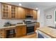 Well-lit kitchen boasting an island, stainless steel appliances, and granite counters at 903 Oldwyck Dr, Fuquay Varina, NC 27526