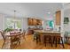 Open kitchen with granite countertops, an island with seating, and breakfast nook at 903 Oldwyck Dr, Fuquay Varina, NC 27526