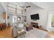 Spacious living room featuring high ceilings, a ceiling fan, and lots of natural light at 903 Oldwyck Dr, Fuquay Varina, NC 27526
