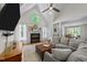 Bright living room showcasing vaulted ceiling, fireplace, and large windows at 903 Oldwyck Dr, Fuquay Varina, NC 27526