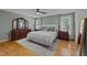 Tranquil main bedroom with hardwood floors, neutral paint, and decorative accents at 903 Oldwyck Dr, Fuquay Varina, NC 27526