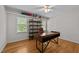 Bright office with hardwood floors, built in shelves, and a large desk at 903 Oldwyck Dr, Fuquay Varina, NC 27526