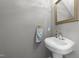 Simple powder room featuring a pedestal sink, and neutral paint at 903 Oldwyck Dr, Fuquay Varina, NC 27526