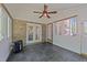 Enclosed sunroom with brick accents, tile floors, and windows overlooking the backyard at 903 Oldwyck Dr, Fuquay Varina, NC 27526