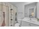 Bright bathroom with a stylish vintage-inspired shower curtain and white vanity at 918 E Green St # F105, Franklinton, NC 27525