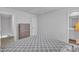 Well-lit bedroom boasts a dresser with a large window and neutral colored walls at 918 E Green St # F105, Franklinton, NC 27525