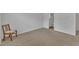 Neutral bedroom featuring an adjacent bathroom and chair at 918 E Green St # F105, Franklinton, NC 27525