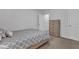 Well-lit bedroom with neutral carpet, gray walls and dresser for plenty of storage at 918 E Green St # F105, Franklinton, NC 27525