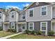 View of townhome with well-kept lawn, tasteful landscaping and walkway to front door at 918 E Green St # F105, Franklinton, NC 27525