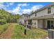 Exterior view of the property with a covered patio and trees at 918 E Green St # F105, Franklinton, NC 27525