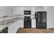 Modern kitchen with white cabinetry, stainless steel appliances, and durable flooring at 918 E Green St # F105, Franklinton, NC 27525