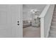 View from entry to the comfortable living space, stairs, and open concept kitchen at 918 E Green St # F105, Franklinton, NC 27525