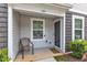 Inviting front porch with room for seating, covered entry, and well maintained landscaping at 918 E Green St # F105, Franklinton, NC 27525