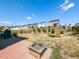 A backyard featuring a built in firepit and a view of neighboring homes at 937 Matterhorn Dr, Fuquay Varina, NC 27526
