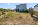 Expansive backyard with a screened-in porch and well-maintained lawn, perfect for outdoor activities and relaxation at 937 Matterhorn Dr, Fuquay Varina, NC 27526
