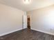 Empty bedroom features sleek laminate flooring, and an open door to a walk in closet at 937 Matterhorn Dr, Fuquay Varina, NC 27526