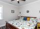 Cozy bedroom with a patterned bedspread, natural light, and a ceiling fan at 937 Matterhorn Dr, Fuquay Varina, NC 27526