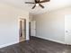 Bedroom features dark laminate flooring, and two open doorways at 937 Matterhorn Dr, Fuquay Varina, NC 27526