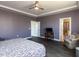 Spacious primary bedroom with hardwood floors, natural light, and an attached ensuite bathroom at 937 Matterhorn Dr, Fuquay Varina, NC 27526