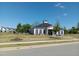 Charming clubhouse featuring large windows, neutral siding, and manicured landscaping, for community gatherings and events at 937 Matterhorn Dr, Fuquay Varina, NC 27526