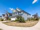 Beautiful two-story home with manicured lawn, lovely landscaping, and charming architectural details on a sunny day at 937 Matterhorn Dr, Fuquay Varina, NC 27526