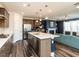 Open-concept kitchen with stainless steel appliances, large island, and views to Gathering room at 937 Matterhorn Dr, Fuquay Varina, NC 27526