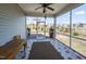 Relaxing screened-in patio featuring outdoor seating and serene views of the backyard at 937 Matterhorn Dr, Fuquay Varina, NC 27526