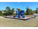 Bright and colorful community playground with slides, climbing structures, and a picnic table for Gathering fun at 937 Matterhorn Dr, Fuquay Varina, NC 27526