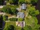 Overhead aerial view of homes with gray roofs surrounded by lush green trees at 959 Sagamore Dr, Louisburg, NC 27549