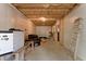 Unfinished basement provides ample storage space with exposed ceiling at 959 Sagamore Dr, Louisburg, NC 27549