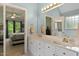 Bathroom with and sinks and views into main bedroom at 959 Sagamore Dr, Louisburg, NC 27549