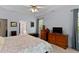 Serene bedroom with a connecting bath, wood furnishings, and soft, natural light at 959 Sagamore Dr, Louisburg, NC 27549