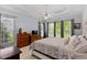 Spacious bedroom with tray ceilings, multiple windows, and comfortable furnishings at 959 Sagamore Dr, Louisburg, NC 27549